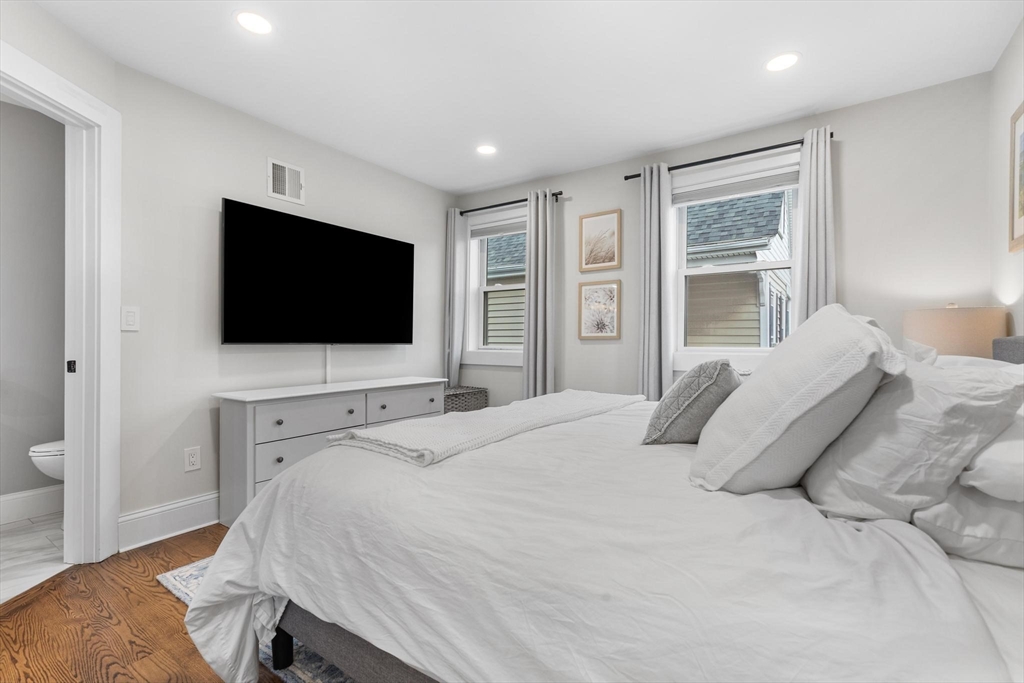 43 Alfred Street, Unit A Everett, MA 02149 - Photo 22 of 29 a bedroom with a bed tv and window