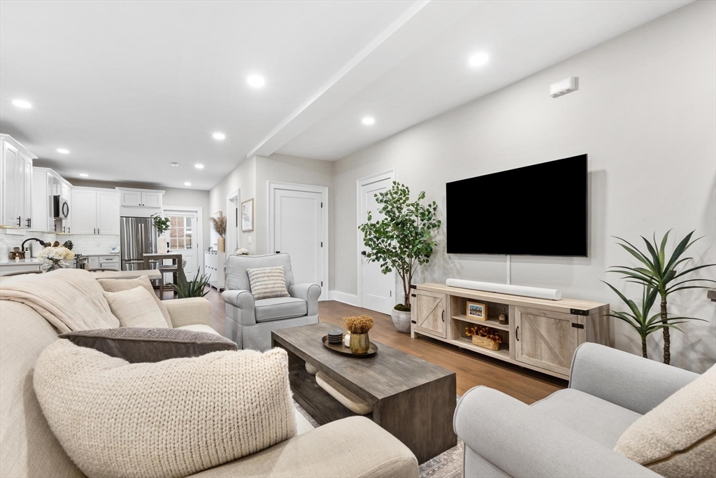43 Alfred Street, Unit A Everett, MA 02149 - Photo 7 of 29 a living room with furniture and a flat screen tv