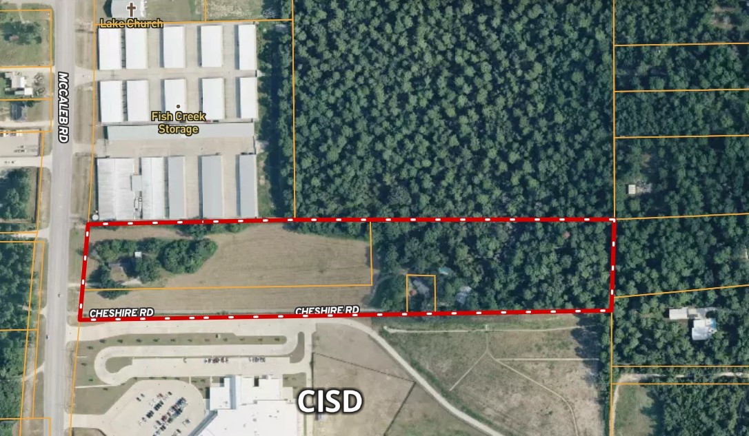 a view of a front door of the house and flowers