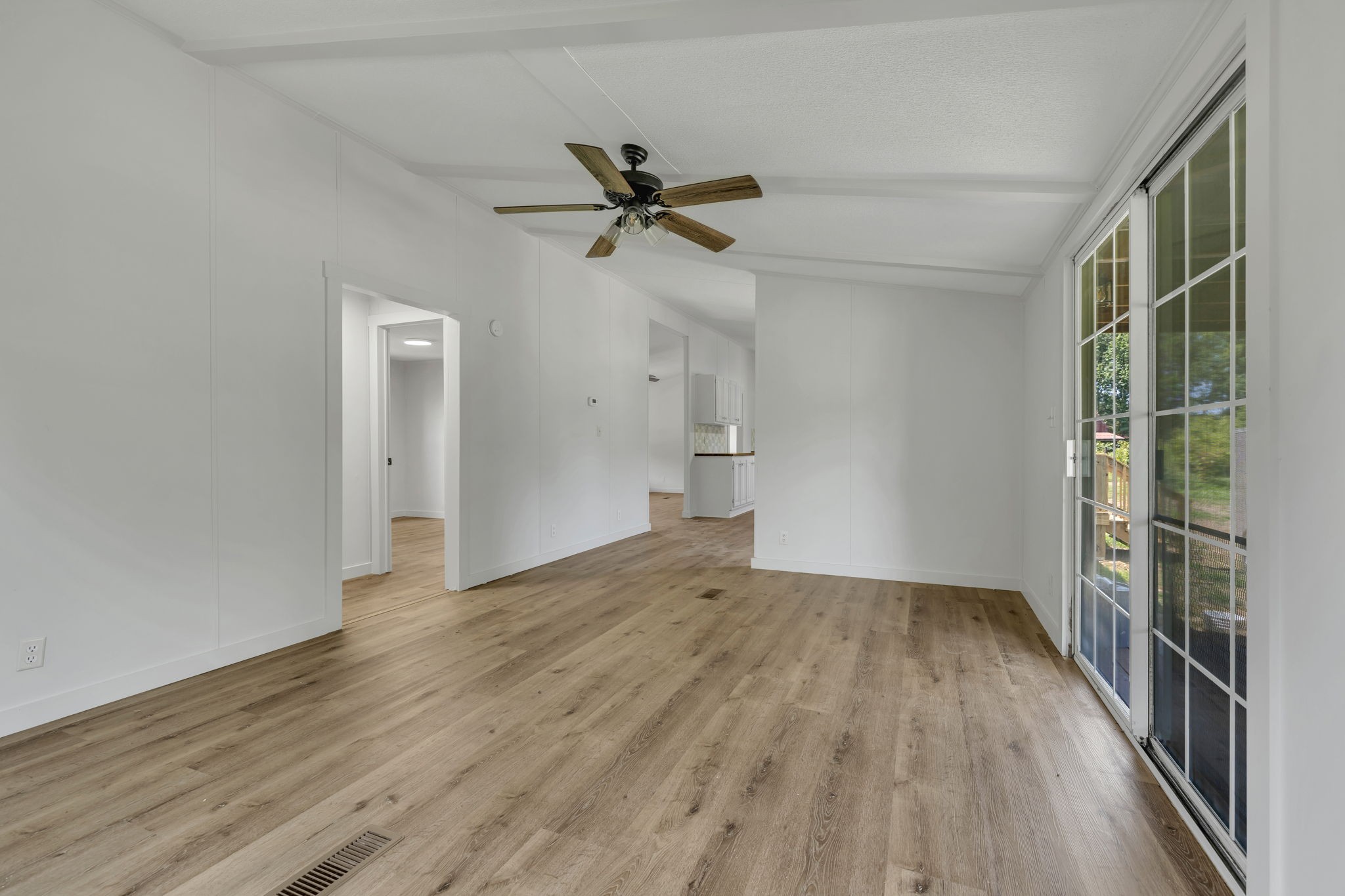 1894 Parker Road Manchester, TN 37355 - Photo 9 of 39 wooden floor in an empty room with a window