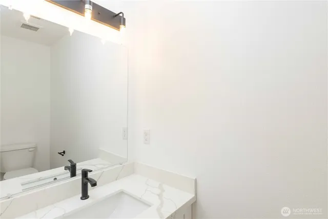 a bathroom with a tub and a sink