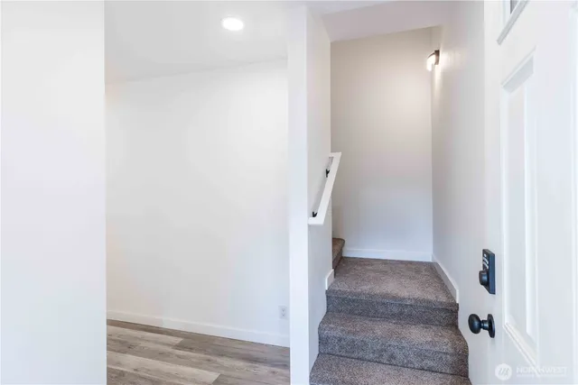 a view of a bathroom with white walls