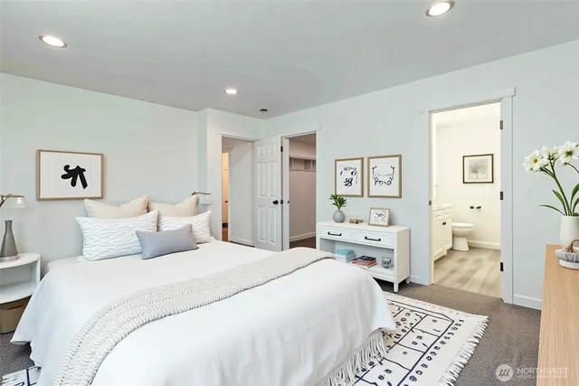 a bedroom with a bed and a view of bathroom