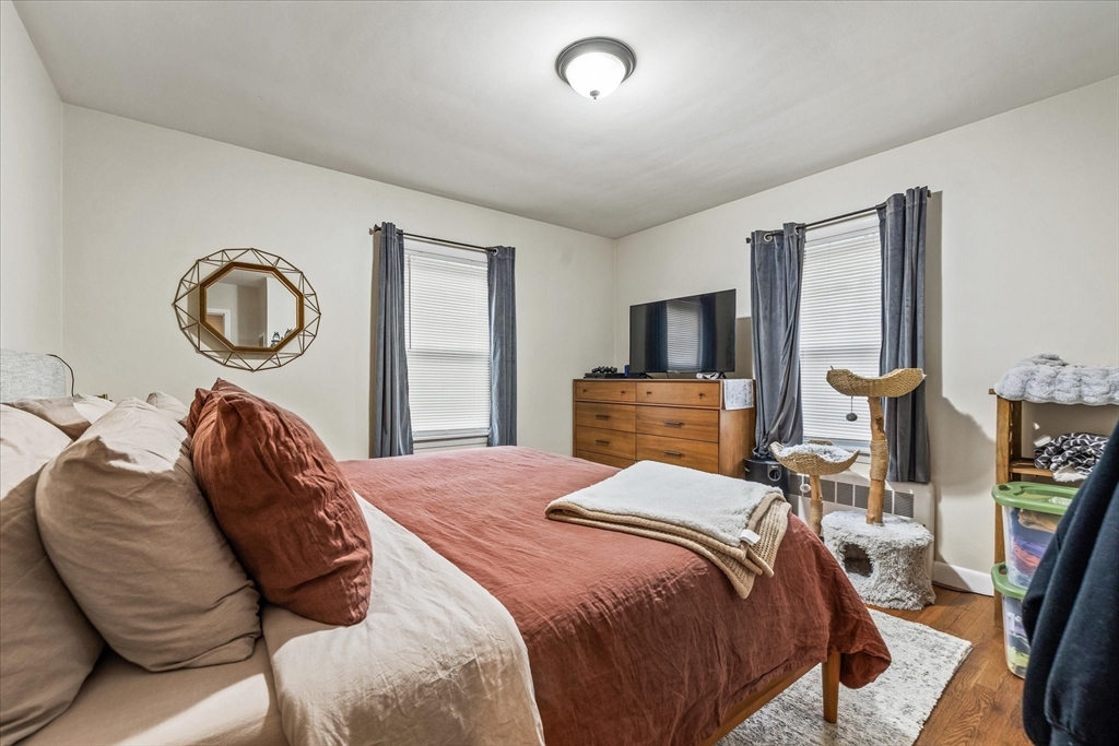 7 Holbrook Road, Unit 2 Oxford, MA 01540 - Photo 11 of 14 a bedroom with a bed and wooden floor