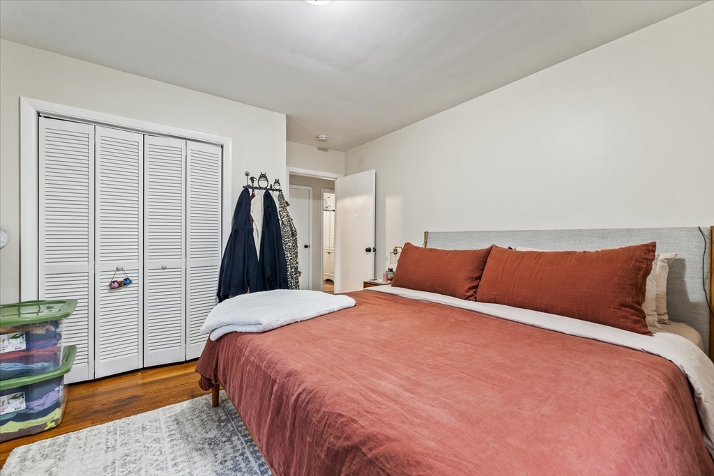 7 Holbrook Road, Unit 2 Oxford, MA 01540 - Photo 12 of 14 a bedroom with a bed and wooden floor