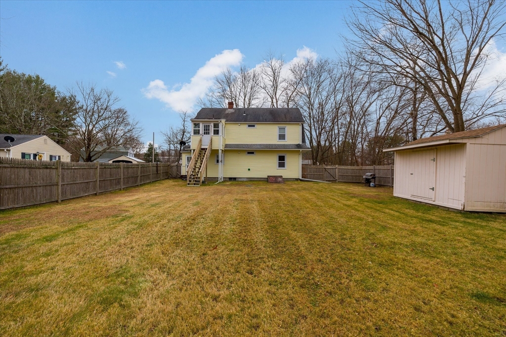 7 Holbrook Road, Unit 2 Oxford, MA 01540 - Photo 3 of 14 a large tree in front of yellow house