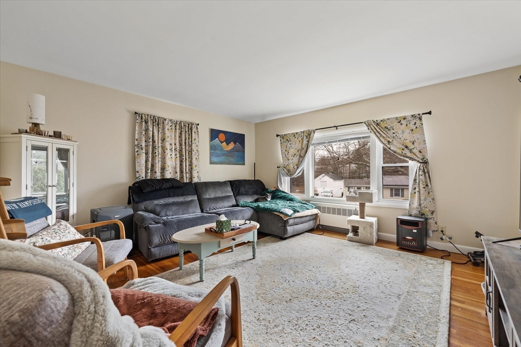 7 Holbrook Road, Unit 2 Oxford, MA 01540 - Photo 4 of 14 a living room with furniture and a large window