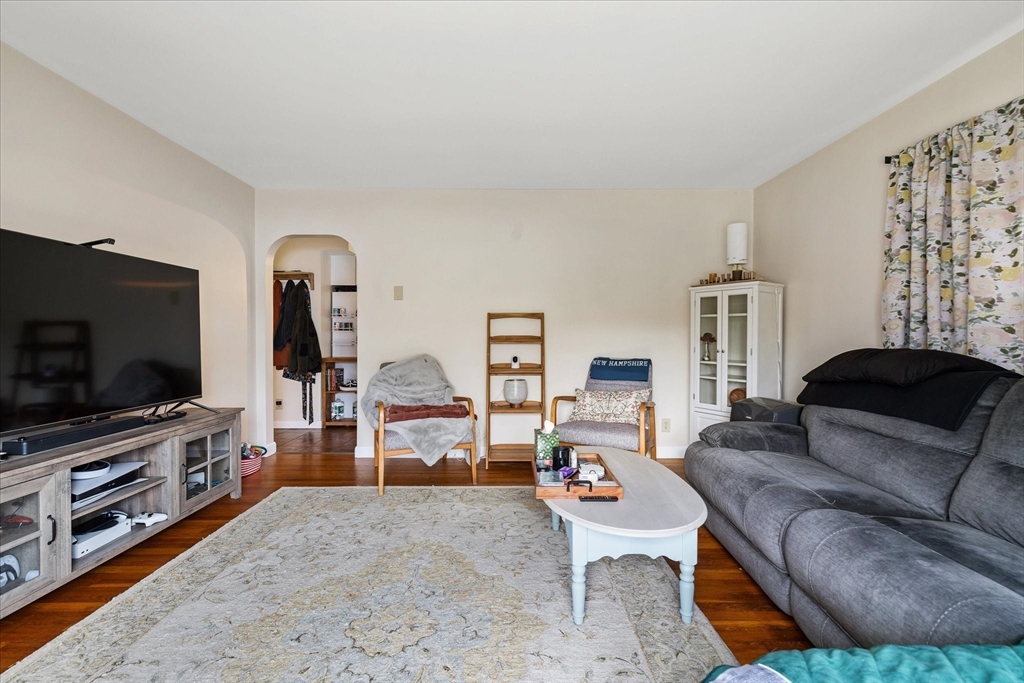 7 Holbrook Road, Unit 2 Oxford, MA 01540 - Photo 5 of 14 a living room with furniture and a flat screen tv