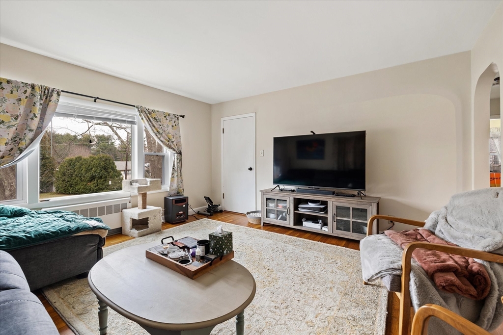 7 Holbrook Road, Unit 2 Oxford, MA 01540 - Photo 6 of 14 a living room with furniture and a flat screen tv