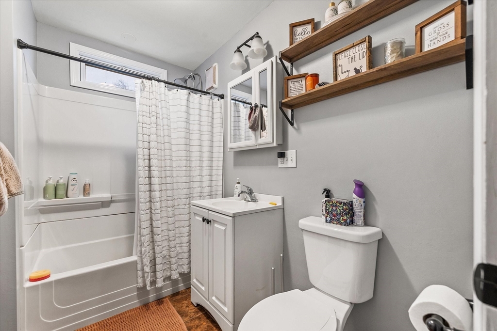 7 Holbrook Road, Unit 2 Oxford, MA 01540 - Photo 10 of 14 a white toilet sitting next to a bathroom sink