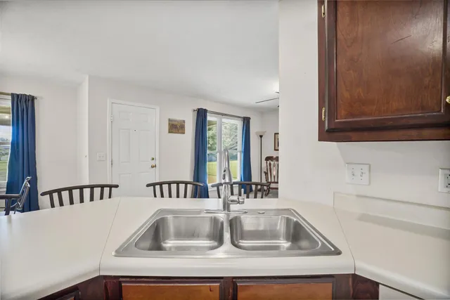 a kitchen with a sink and cabinets