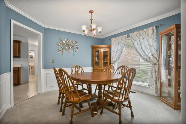 a spacious bedroom with a bed and a cabinets