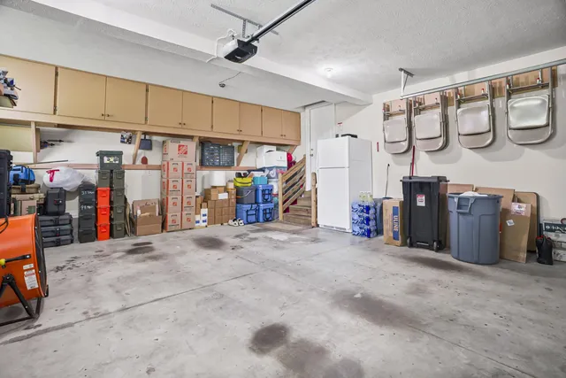 a view of an house with backyard and porch