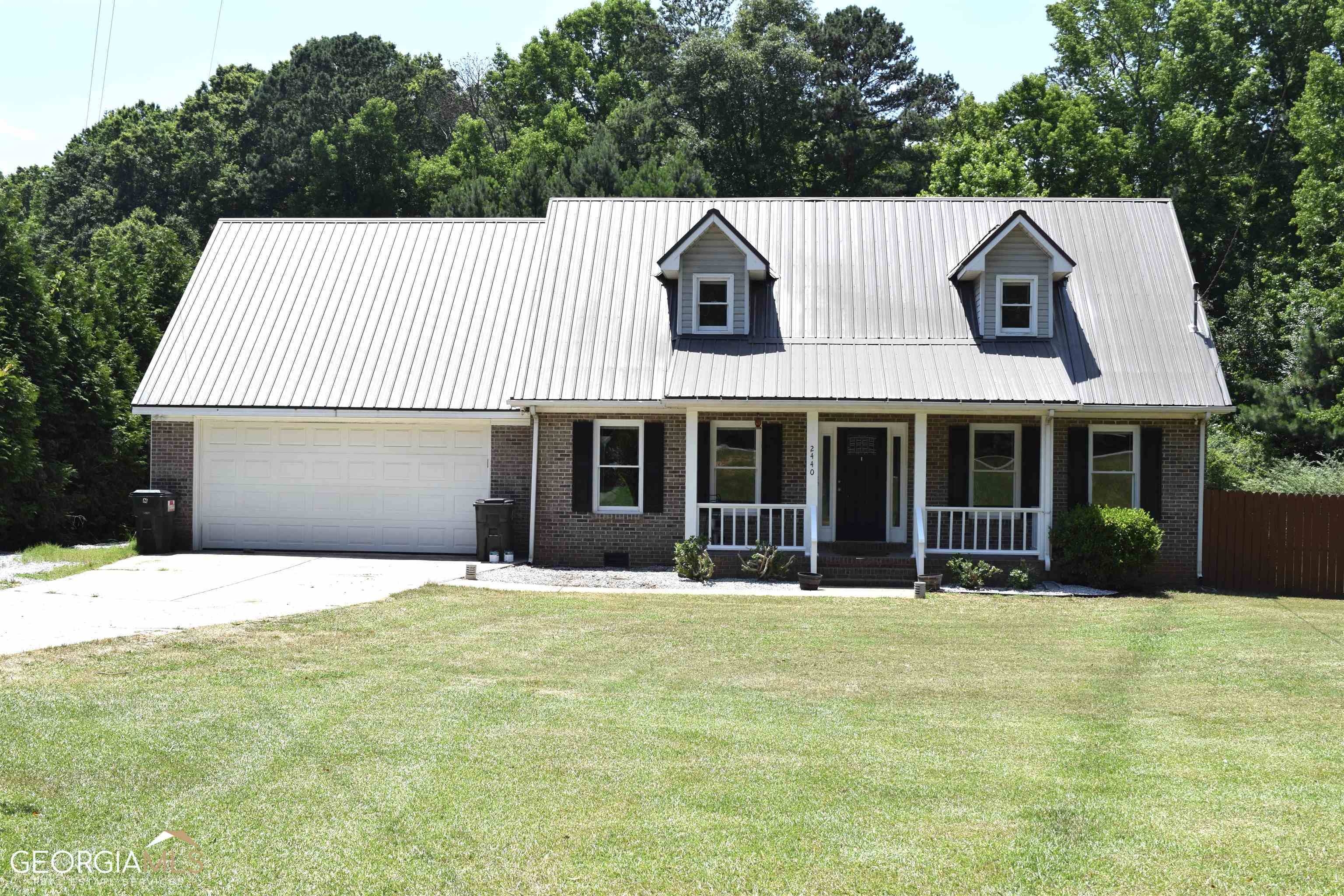 2440 Union Church Road Bishop, GA 30621 - Photo 1 of 1 a front view of a house with a garden