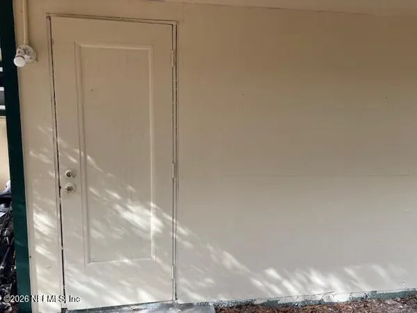 a bathroom with a glass shower door