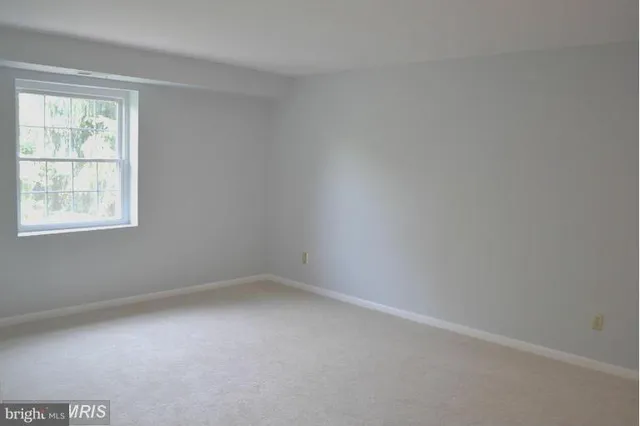 a bathroom with a sink toilet and a mirror