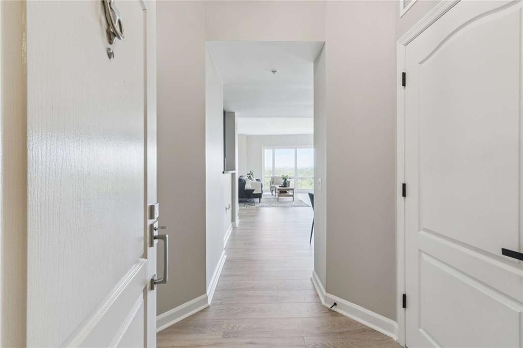 3475 Oak Valley Road Northeast, Unit 1570 Atlanta, GA 30326 - Photo 18 of 29 a view of a hallway with a livingroom and couch