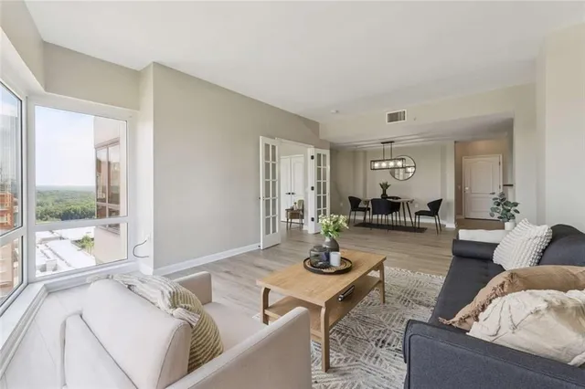 a living room with furniture and a table