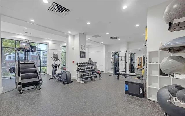 a living room with furniture a glass door and furniture