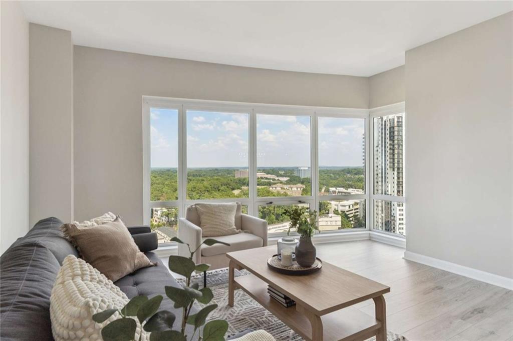 3475 Oak Valley Road Northeast, Unit 1570 Atlanta, GA 30326 - Photo 5 of 29 a living room with furniture and a potted plant