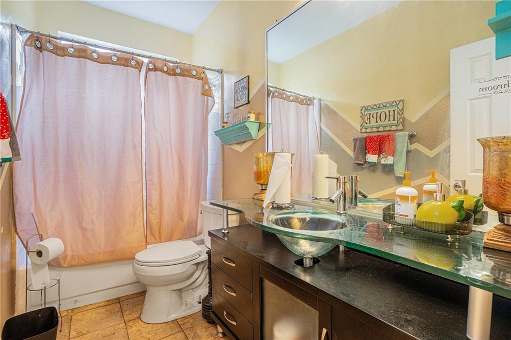 6507 Rebecca Way Lithonia, GA 30058 - Photo 17 of 31 a room with a large window and couch