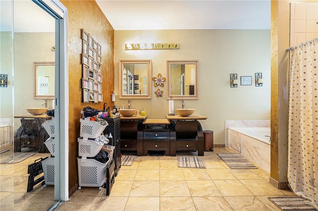 6507 Rebecca Way Lithonia, GA 30058 - Photo 19 of 31 a living room with furniture and a flat screen tv