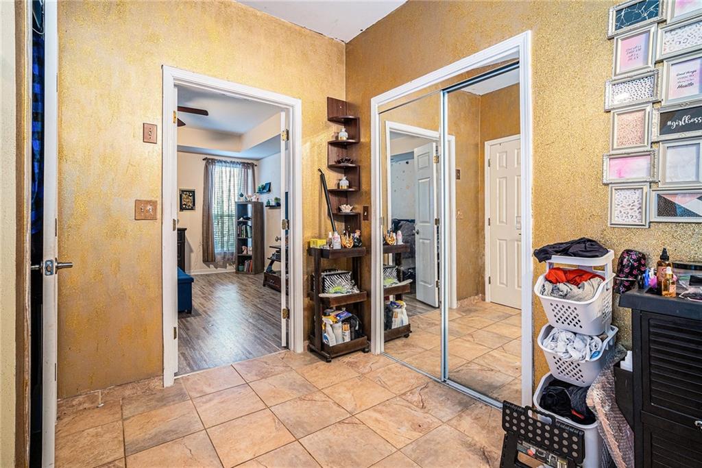 6507 Rebecca Way Lithonia, GA 30058 - Photo 20 of 31 a view of a bedroom with a furniture and closet
