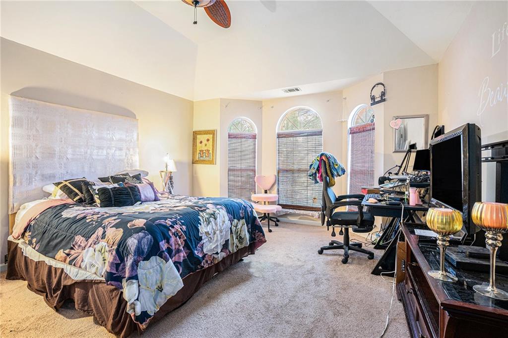 6507 Rebecca Way Lithonia, GA 30058 - Photo 22 of 31 a bed room with two bed and a flat screen tv