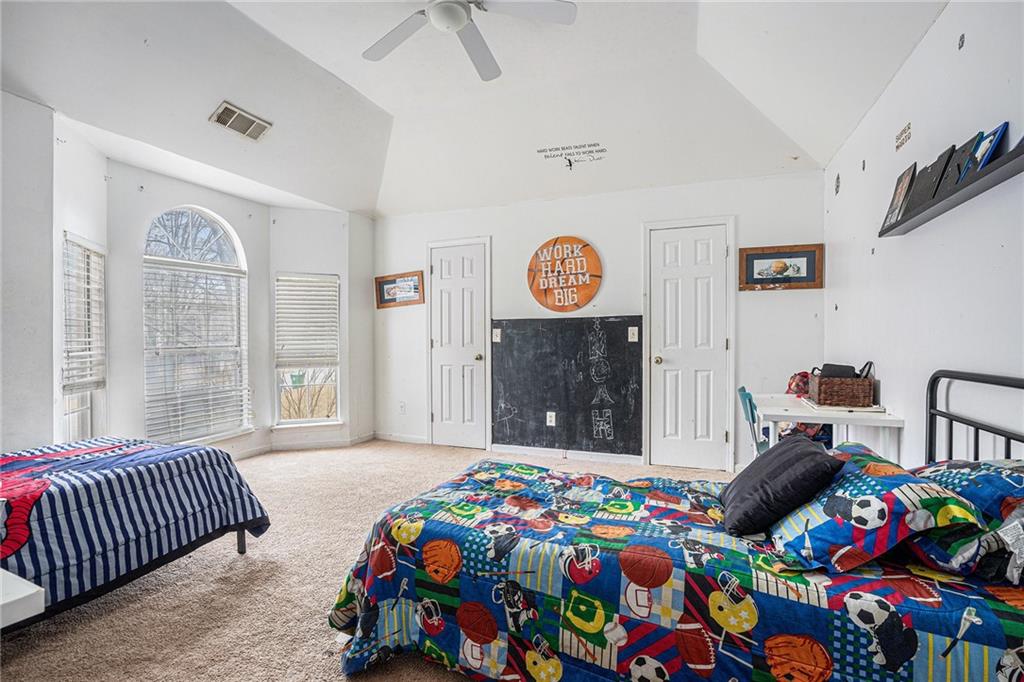 6507 Rebecca Way Lithonia, GA 30058 - Photo 24 of 31 a bedroom with a bed and a window