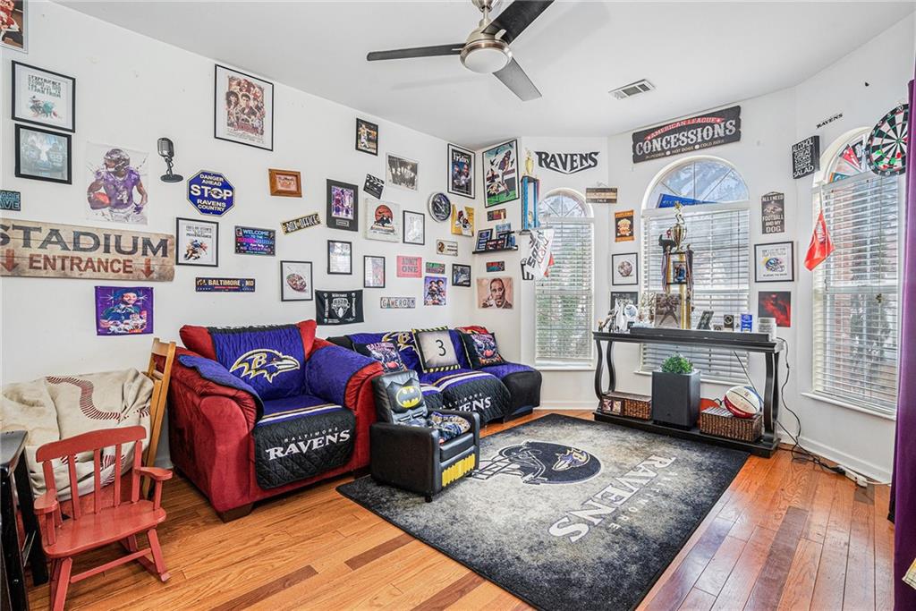 6507 Rebecca Way Lithonia, GA 30058 - Photo 26 of 31 a living room with furniture and wooden floor