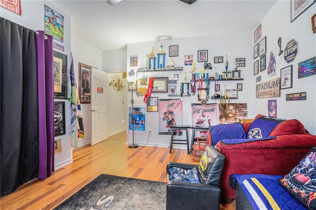 6507 Rebecca Way Lithonia, GA 30058 - Photo 27 of 31 a living room with furniture and a book shelf