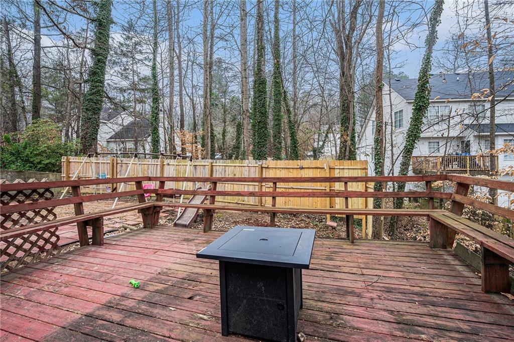 6507 Rebecca Way Lithonia, GA 30058 - Photo 29 of 31 a view of a rooftop deck with chairs and tables