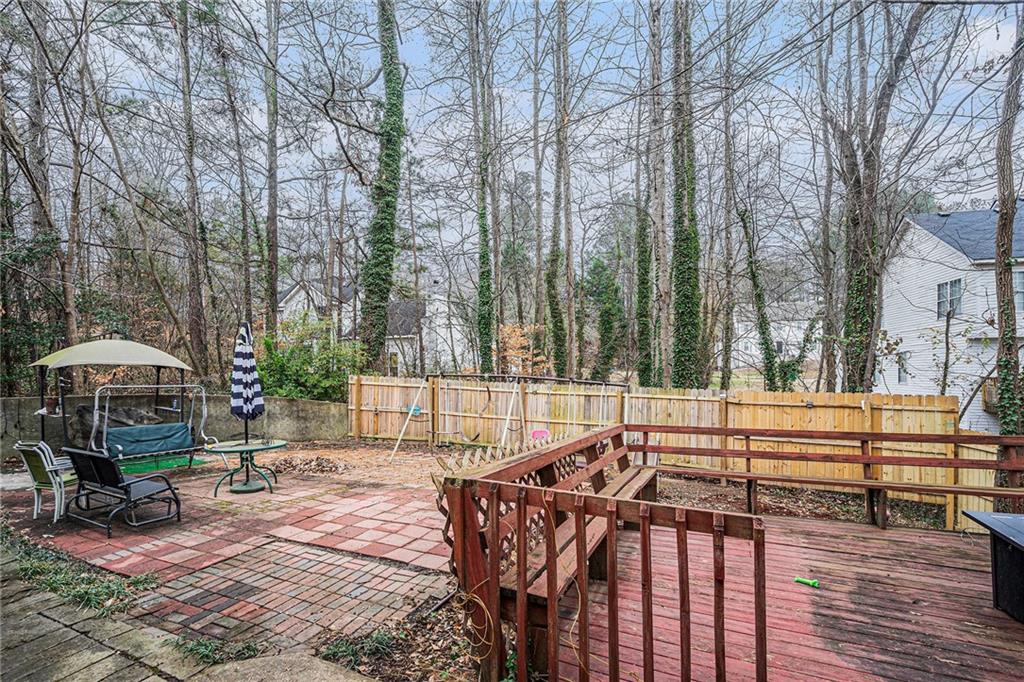 6507 Rebecca Way Lithonia, GA 30058 - Photo 30 of 31 a view of a swimming pool with a patio and a yard