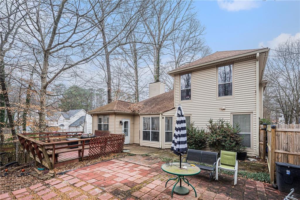 6507 Rebecca Way Lithonia, GA 30058 - Photo 31 of 31 a white bench sitting in backyard of a house