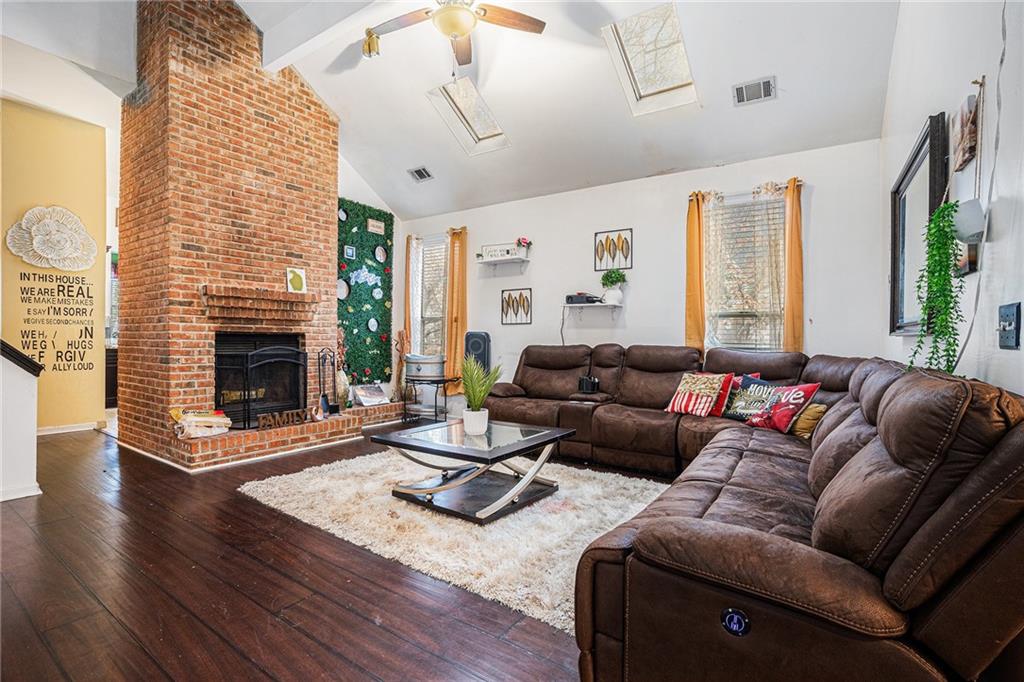 6507 Rebecca Way Lithonia, GA 30058 - Photo 5 of 31 a living room with furniture and a fireplace