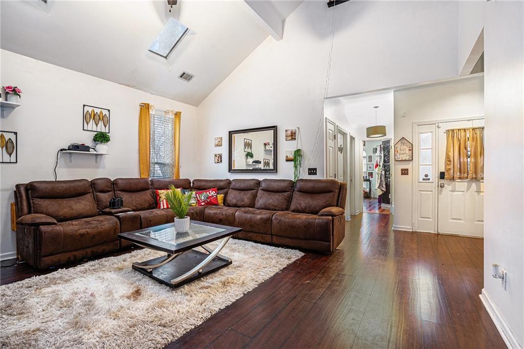 6507 Rebecca Way Lithonia, GA 30058 - Photo 6 of 31 a living room with furniture and wooden floor