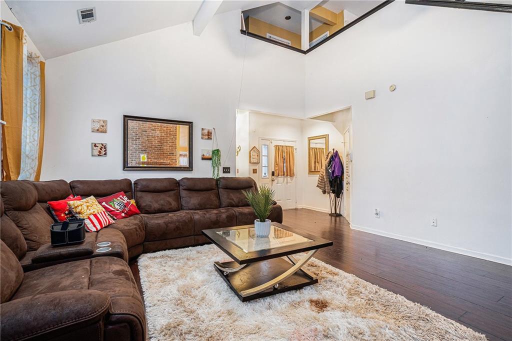 6507 Rebecca Way Lithonia, GA 30058 - Photo 7 of 31 a living room with furniture and wooden floor