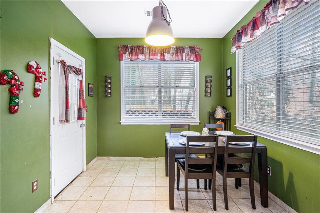 6507 Rebecca Way Lithonia, GA 30058 - Photo 8 of 31 a dining room with furniture and window