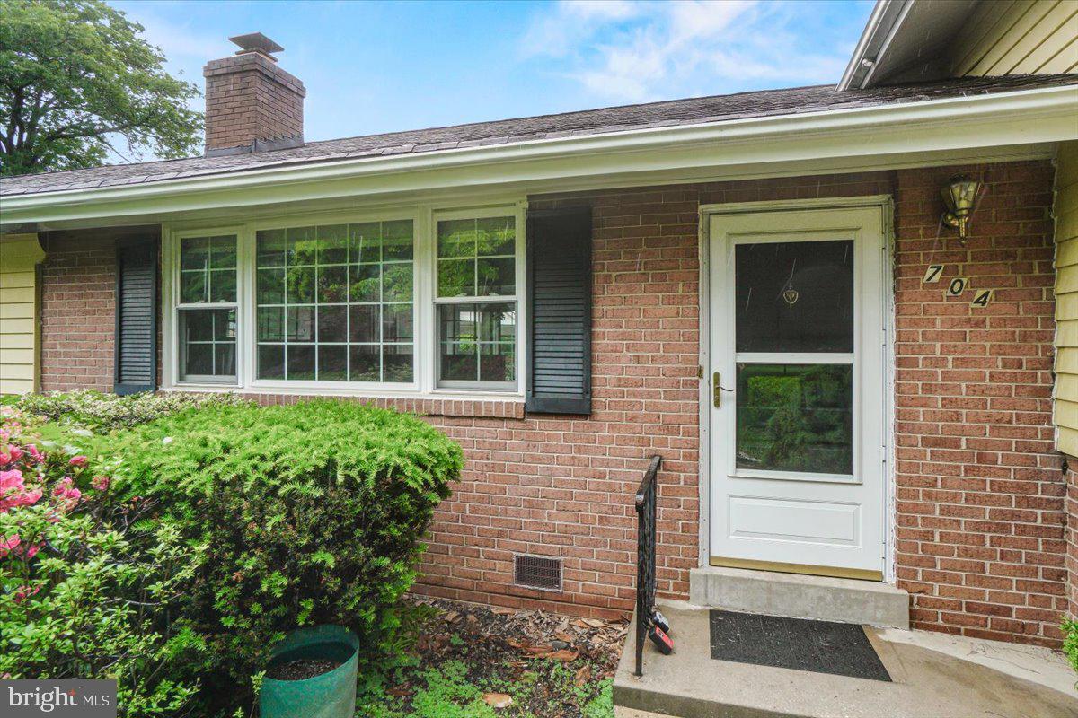 704 Ednor Road Ashton, MD 20861 - Photo 11 of 39 a view of a house with potted plants