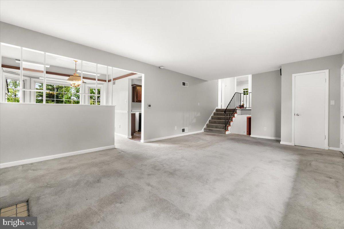 704 Ednor Road Ashton, MD 20861 - Photo 13 of 39 a view of empty room with a fireplace