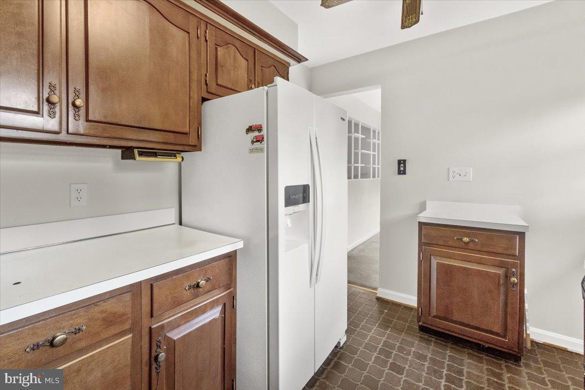 704 Ednor Road Ashton, MD 20861 - Photo 18 of 39 a view of cabinets and utility room with closet