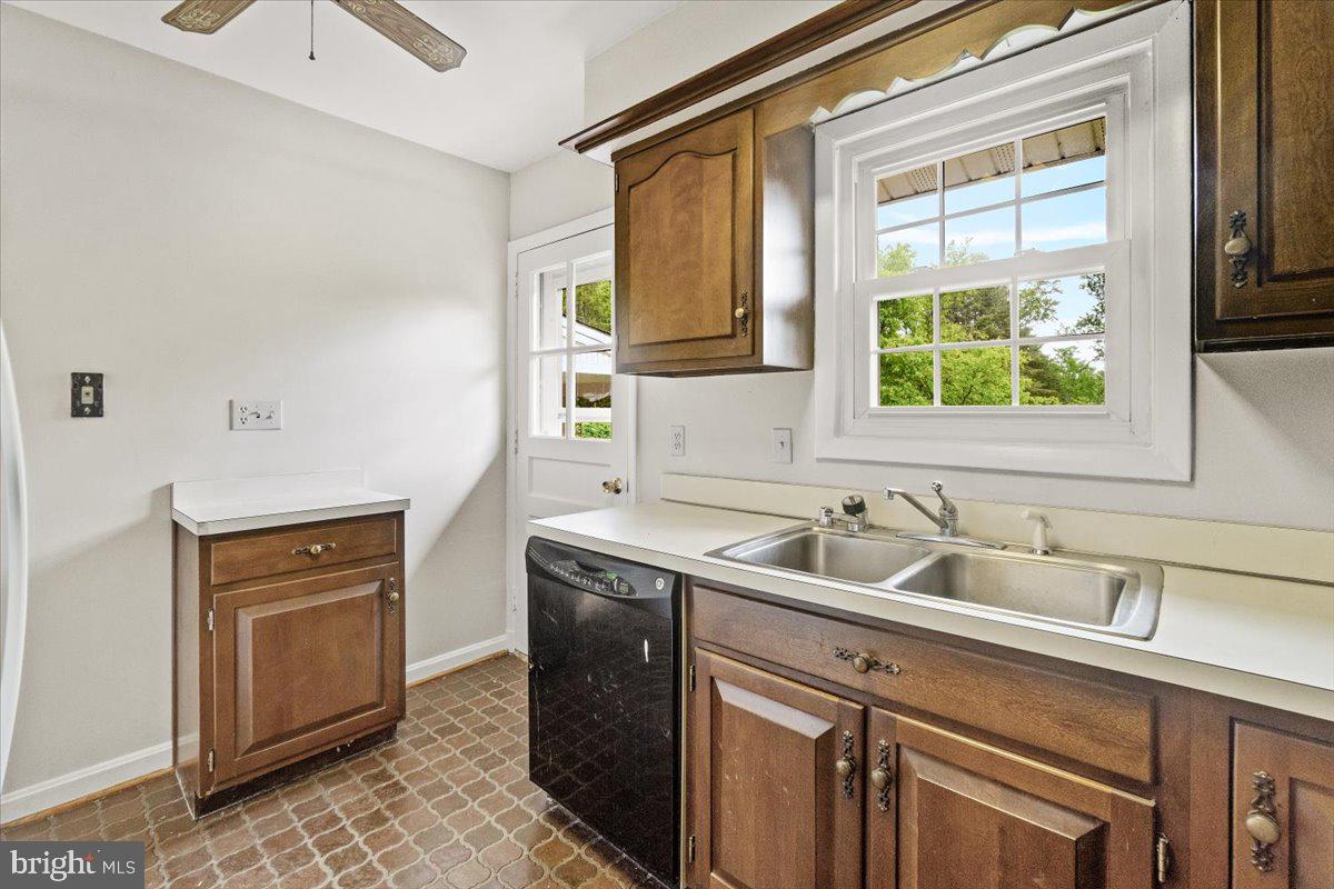 704 Ednor Road Ashton, MD 20861 - Photo 19 of 39 a kitchen with a sink cabinets and window