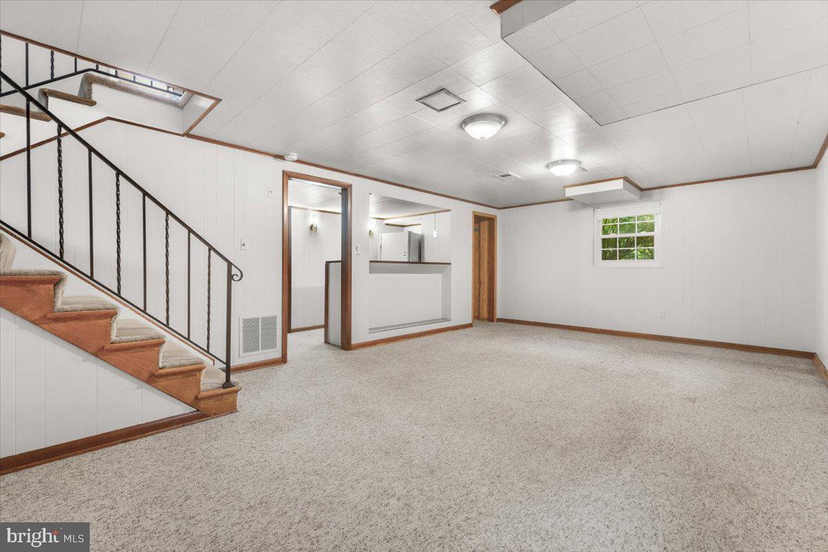 704 Ednor Road Ashton, MD 20861 - Photo 29 of 39 a view of an empty room with a window