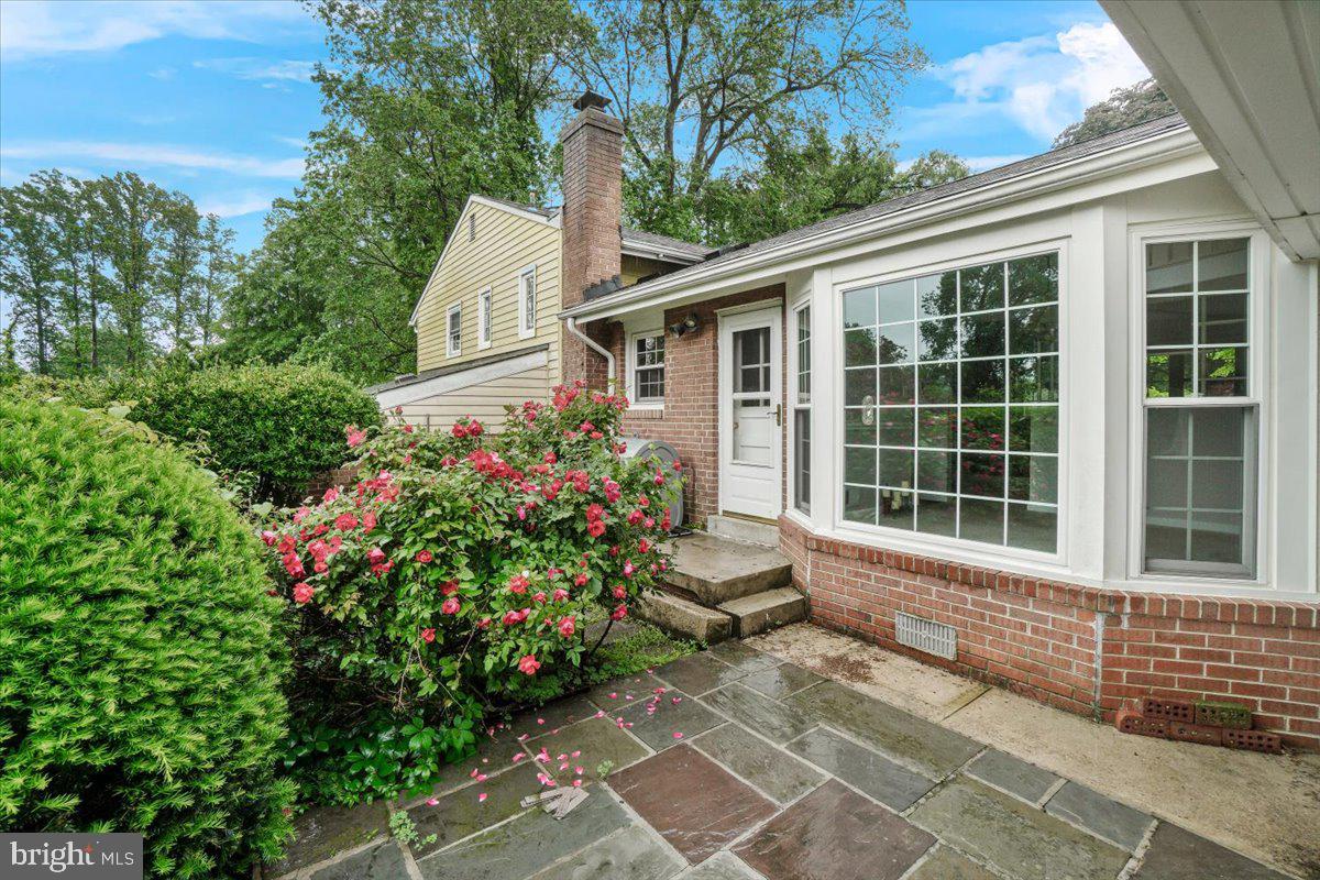 704 Ednor Road Ashton, MD 20861 - Photo 10 of 39 a house with flowers in front of it