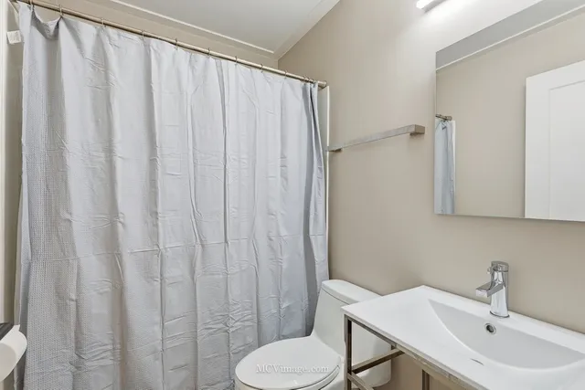 a bathroom with a sink and a toilet