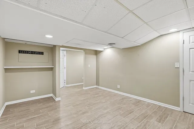 a bathroom with a bathtub sink mirror and toilet