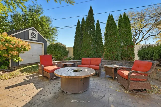 a view of swimming pool with lounge chair and potted plants