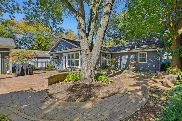 a view of a patio with table and chairs and potted plants