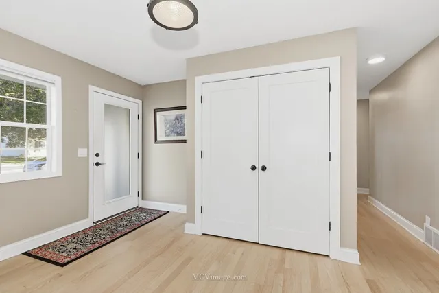 a view of room with window and wooden floor