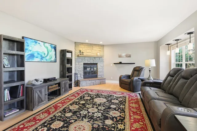 a living room with furniture and a book shelf